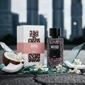 Perfume bottle and packaging with 'MOOD' branding on a gradient background