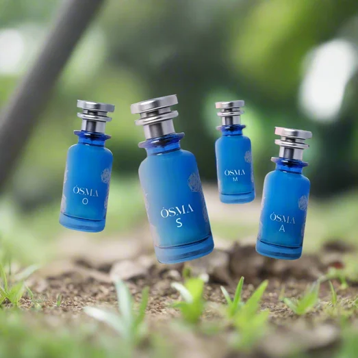 Four blue perfume bottles labeled 'OSMA' against a scenic background with water and sky