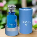 Blue Osma M perfume bottle with matching cylindrical container on a white background