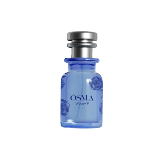 Blue perfume bottle with silver cap on a white background