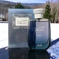 Blue perfume bottle labeled 'Hawas Ice for Him Rasasi for men' on a snowy background
