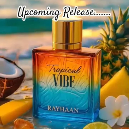 Perfume bottle labeled 'Tropical Vibe' by Rayhaan with a beach-themed background featuring a pineapple, coconut, and lime.