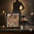 Carino Black by Rue Broca perfume bottle and box on dark marble candlelight women scent