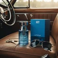 Rue Broca Luminus Pour Homme bottle and box on leather car seat classic car men fragrance