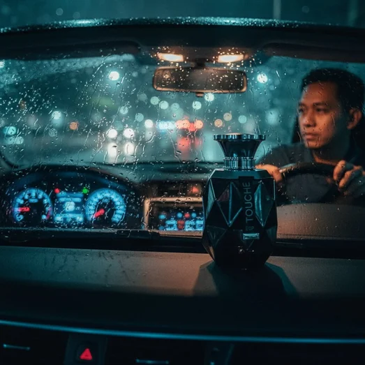 Rue Broca Touche Pour Homme perfume bottle on car dashboard rainy KL lights men scent Malaysia