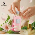 Woman unboxing Darlene Pour Femme by Volare perfume gift moment