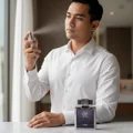 Malay lelaki in white shirt with Zimaya Abadi Opulent perfume on marble morning lelaki scent Malaysia