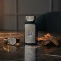 Al Embratur Intense by Zimaya perfume bottle on dark marble with gold watch and amber light men fragrance