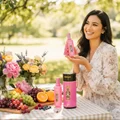 Malay woman holding Andalusi Pink by Zimaya perfume at garden picnic romantic fragrance