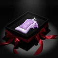 Fatima Velvet Love 100 ml Extrait by Zimaya – Purple perfume bottle in a black box with a red ribbon on a dark background