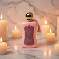 Fatima by Zimaya perfume bottle surrounded by candles on marble vanity amber light