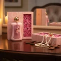 Fatima by Zimaya perfume bottle with pearl necklace and oud chips on vanity candlelight