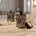 Happy Oud by Zimaya perfume bottle in mirror reflection with petals elegantt unisex scent