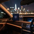 Mazaaj Infused by Zimaya perfume bottle on luxury car dashboard with KL city lights night masculine fragrance