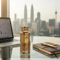 Men's perfume modhesh bottle on glass desk with laptop gold pen lifestyle