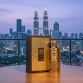 Men's perfume bottle on KL balcony pre-dawn reflection of skyline – Modhesh Aura