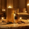 Noor Oud Dubai by Zimaya perfume bottle on gold marble table with oud wood and candlelight luxury unisex fragrance