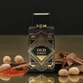 Perfume bottle labeled 'Oud is Great' with decorative elements on a reflective surface