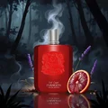 Red Paragon Eau de Parfum bottle with lavender and orange in a forest setting