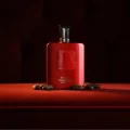 Red Carpet Paragon by Zimaya perfume bottle on velvet sofa amber light luxury unisex scent
