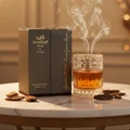 Sharaf Blend by Zimaya perfume bottle on marble with gold reflections and oud smoke unisex fragrance