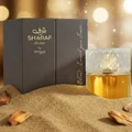 Sharaf Divine Perfume bottle in golden desert sand with oud glow