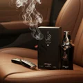 Taraf Black by Zimaya perfume bottle on leather seat with oud smoke masculine scent