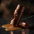 Broken perfume bottle releasing cocoa powder and caramel aroma – Tiramisu Coco