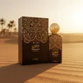 Wameed by Zimaya perfume bottle and box on desert sand golden hour unisex fragrance