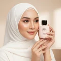 Malay woman in white hijab holding Zimaya Yaa Umree perfume graceful smile floral women scent
