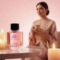Zimaya Yaa Umree perfume bottle in candlelight Malay woman evening soft vanilla scent