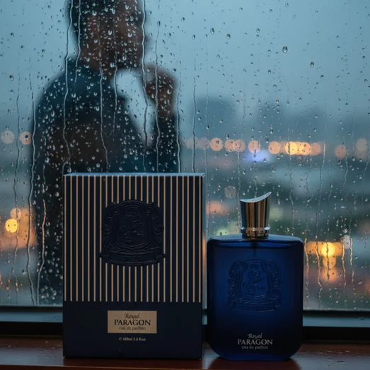 Zimaya Royal Paragon botol minyak wangi on window ledge with rainy KL city lights lelaki fragrance Malaysia