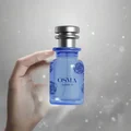 Blue Osma Amber S perfume bottle on a white background