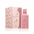 Pink perfume bottle and packaging with decorative elements on a white background